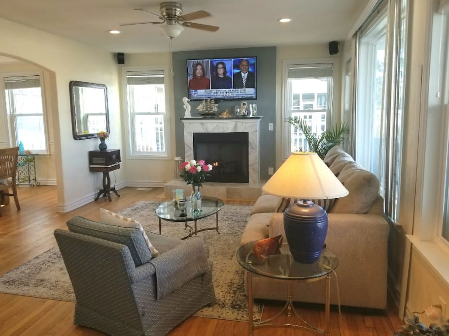 Living room with views of the Chesapeake Bay & Pool, gas fireplace, smart t.v.