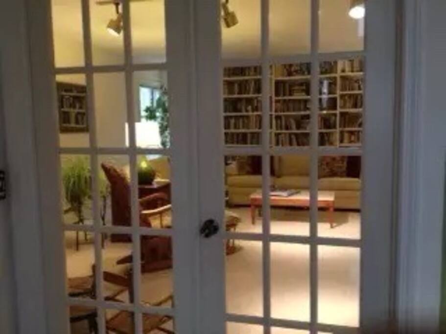 Living room. One of three sitting rooms. Includes two sets of doors.