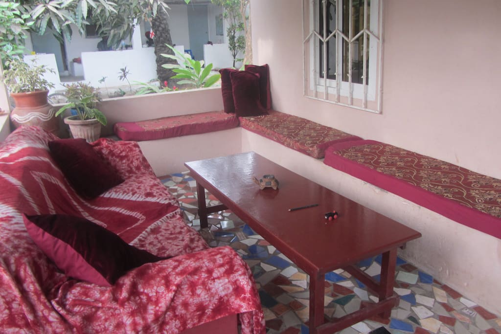 The comfortable veranda of the main house available to guests and visitors. A kitchen area with gas and other facilities at one end.