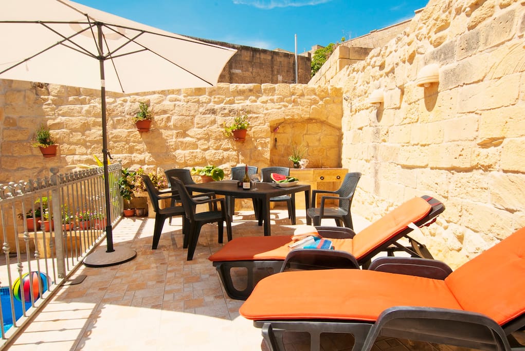 Sun loungers dining area and gas BBQ