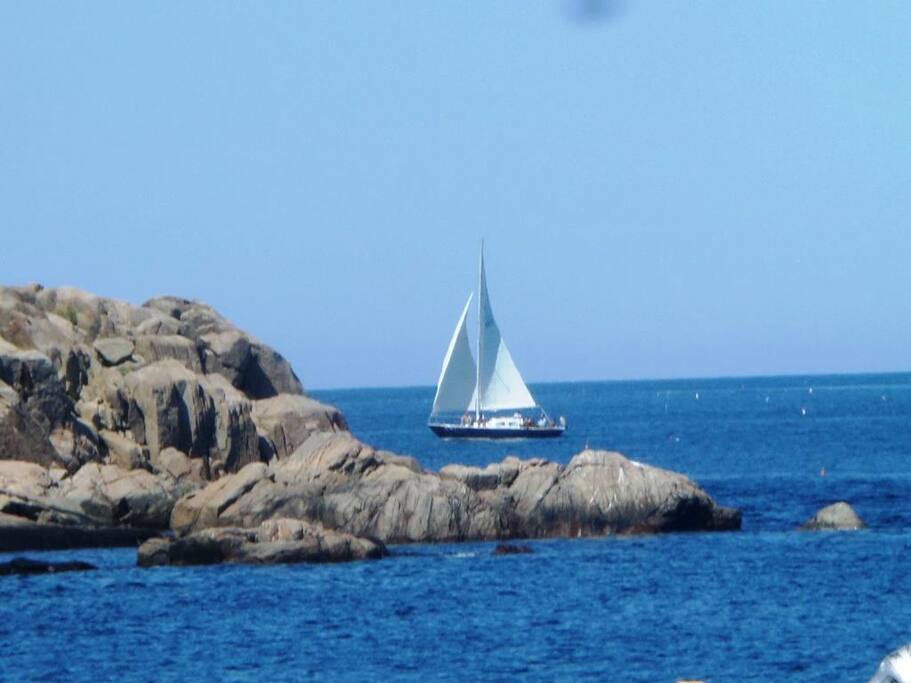 Rockport Seaside Retreat-View of passing boat from waterfront.