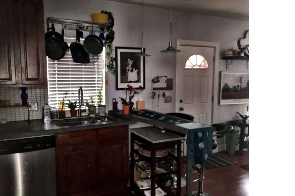 Loft type with concrete counters, large farmhouse sink, eat at counter bar, kitchen cart, dishwasher...