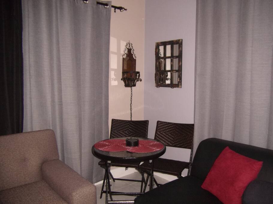Table for two and comfy chair.