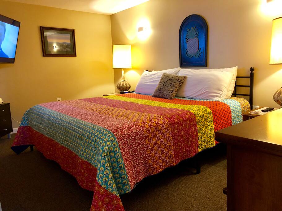 King bed that guests find very comfy with an HD tv, usb plugs for phones, and multiple lighting options.