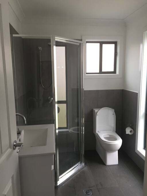 Brand new ultra modern bathroom with laundry tub...