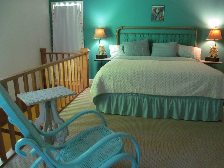 Bedroom is spacious and leads to deck and bathroom.