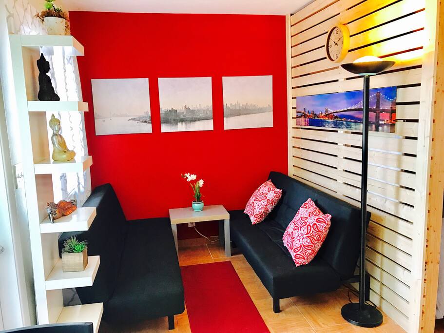 Sitting area with two twin size futons .