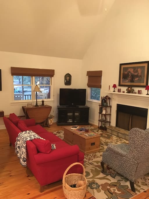 Comfortable living room with gas logs and tv with 190 channels.