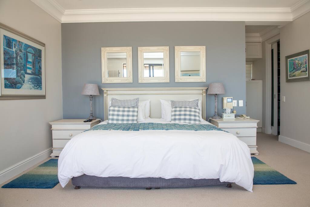 Master bedroom - king sized bed, with a private living area with TV (DTSV) and walk in wardrobe