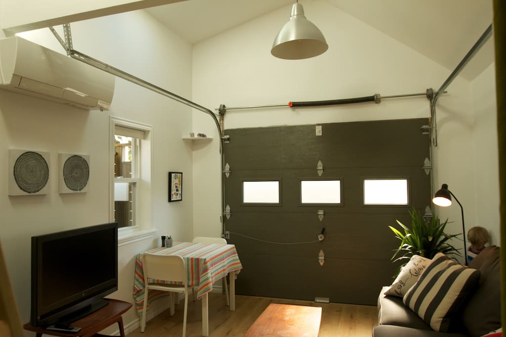The garage door is fully insulated and opens to the back laneway.