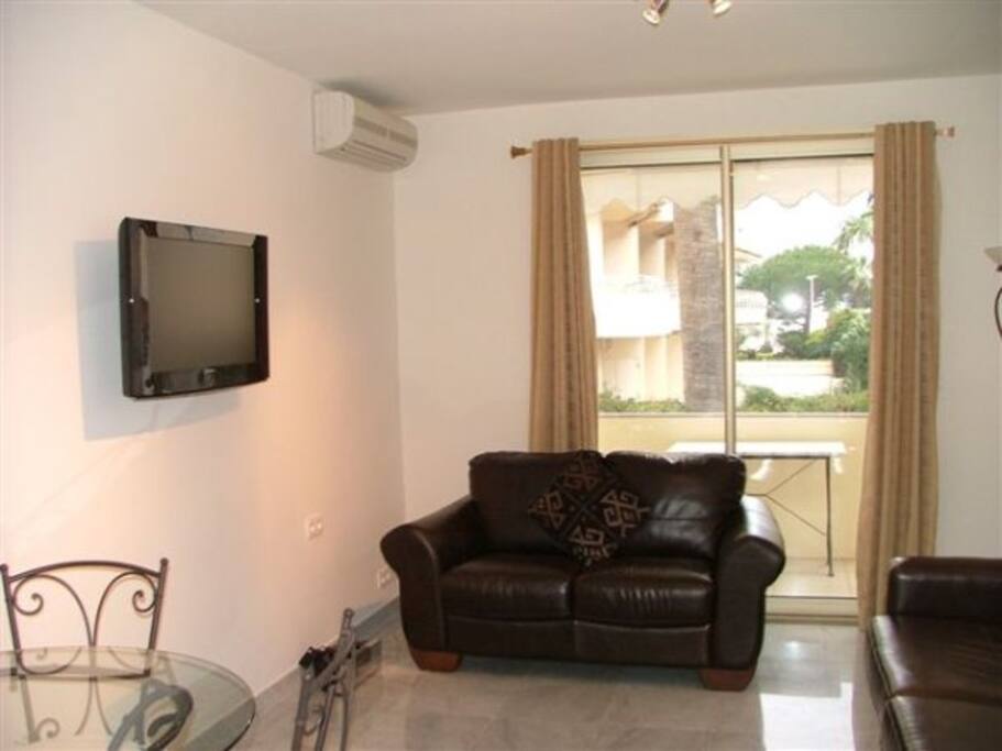 Lounge with patio door to balcony