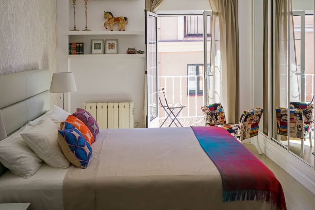 Master bedroom with balcony and full wall closet
