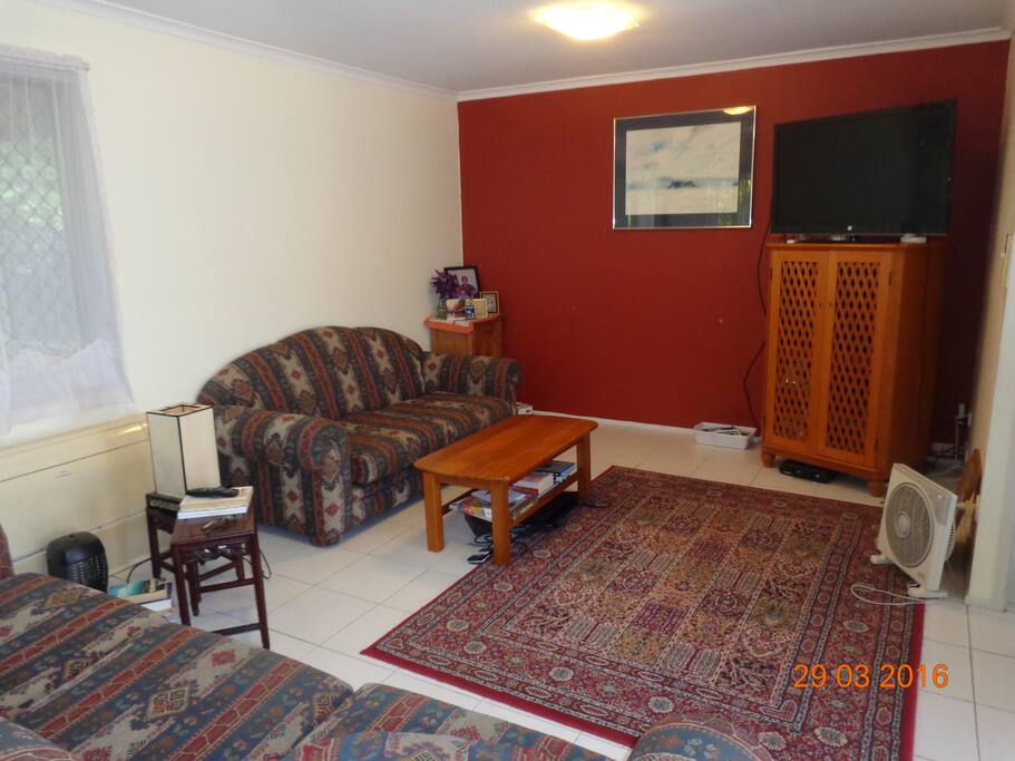 Living area, TV, DVD, comofortable 3 seater and two seater couches, airconditioning, fans
