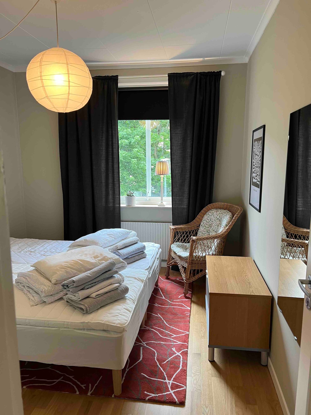 The smaller bedroom with two beds, easy to make a kingsize double or have as two single beds. In the bedroom there’s also a wardrobe for hanging your clothes.