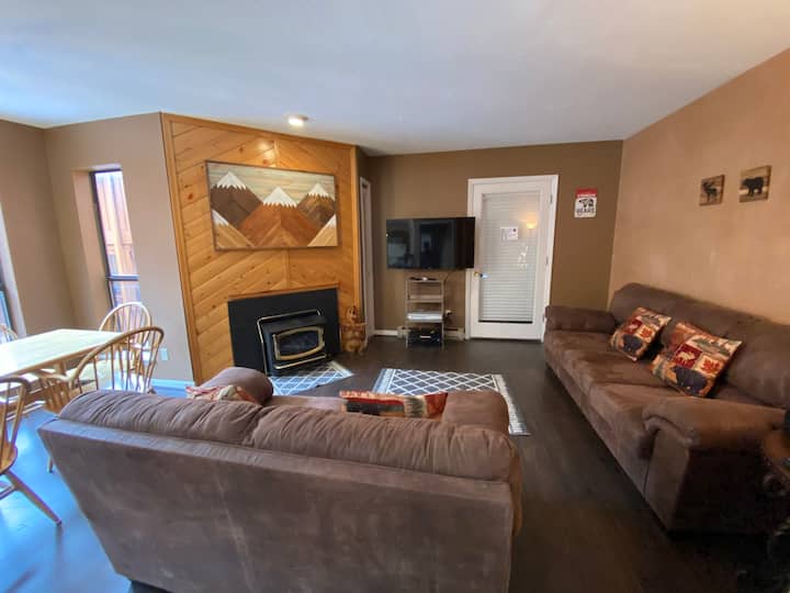 Living space includes couch, love seat, a few TV trays, table for 6 and three stools at the bar area. 
There is also a fireplace. Wood is not provided but can be purchased at the local grocery store. Please leave coals in the fireplace to cool. 