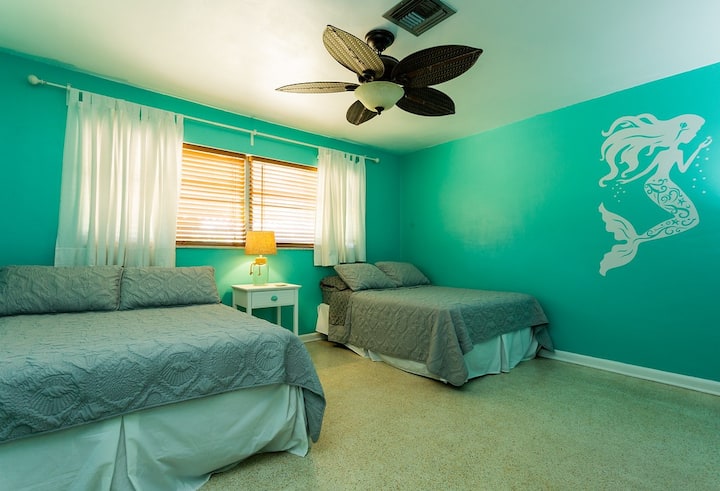 Mermaid Room with two full beds, walk-in closet, TV and ceiling fan