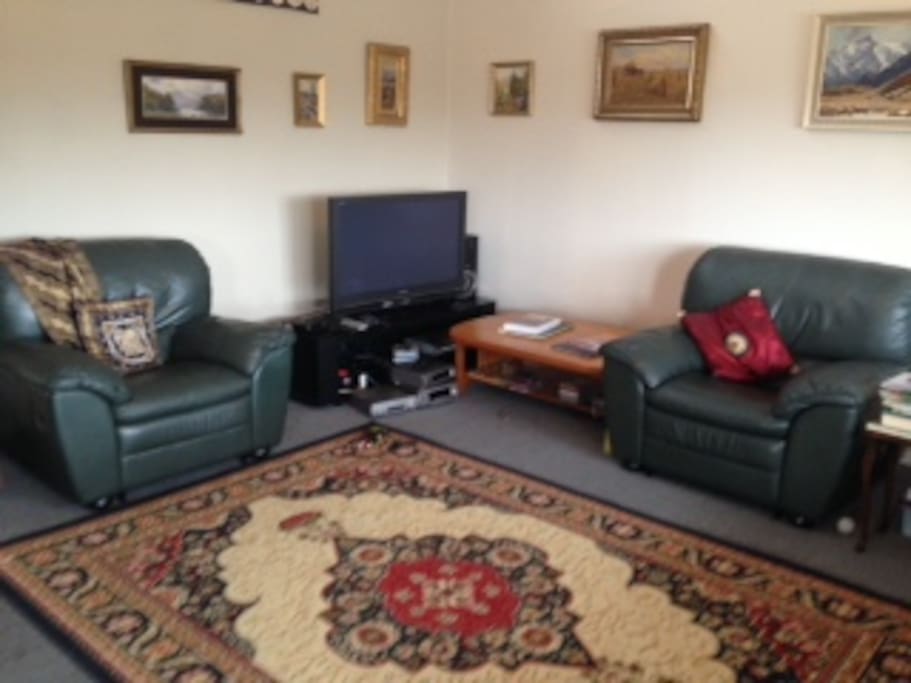 Relax in the leather lounge suite and watch TV