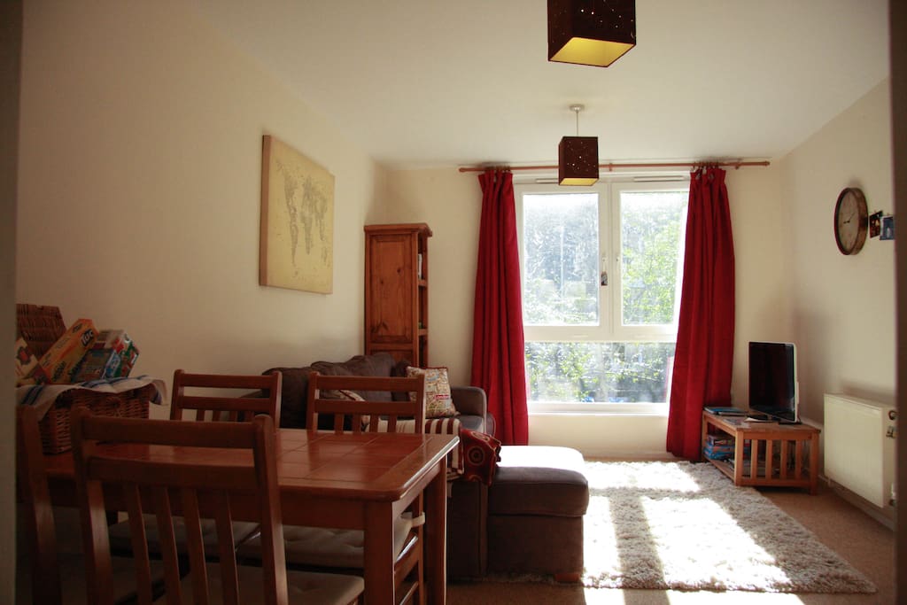 Large open plan dining/lounge room with large windows allowing plenty of light.