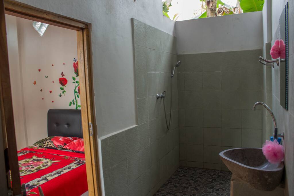 The room has an open bathroom. There is nothing like taking a shower while listening to the sounds of the birds. But be aware that there might be insects coming in to the bathroom if you leave the light no.