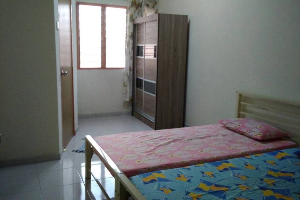 Bedroom 2 (upstairs) with fan, two single bed, and wardrobe. Shared toilet & shower (+heater) with Bedroom 3. Book this room alone at RM70 (USD18)