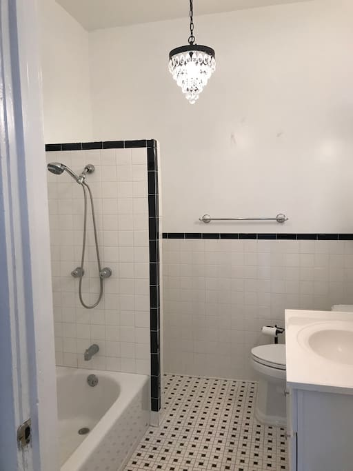 Beautiful elegant
And white bathroom has been updated with new rug/shower curtain.