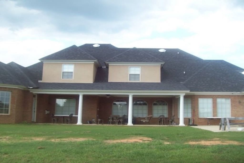 Back of house with patio