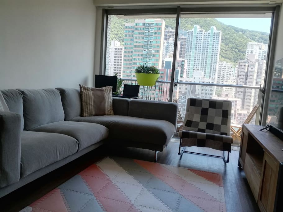 Large relaxing sofa overlooking the urban view