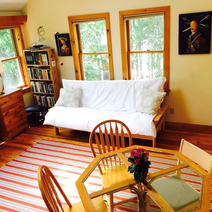 The upstairs loft AKA music room. with a piano in this sun filled space