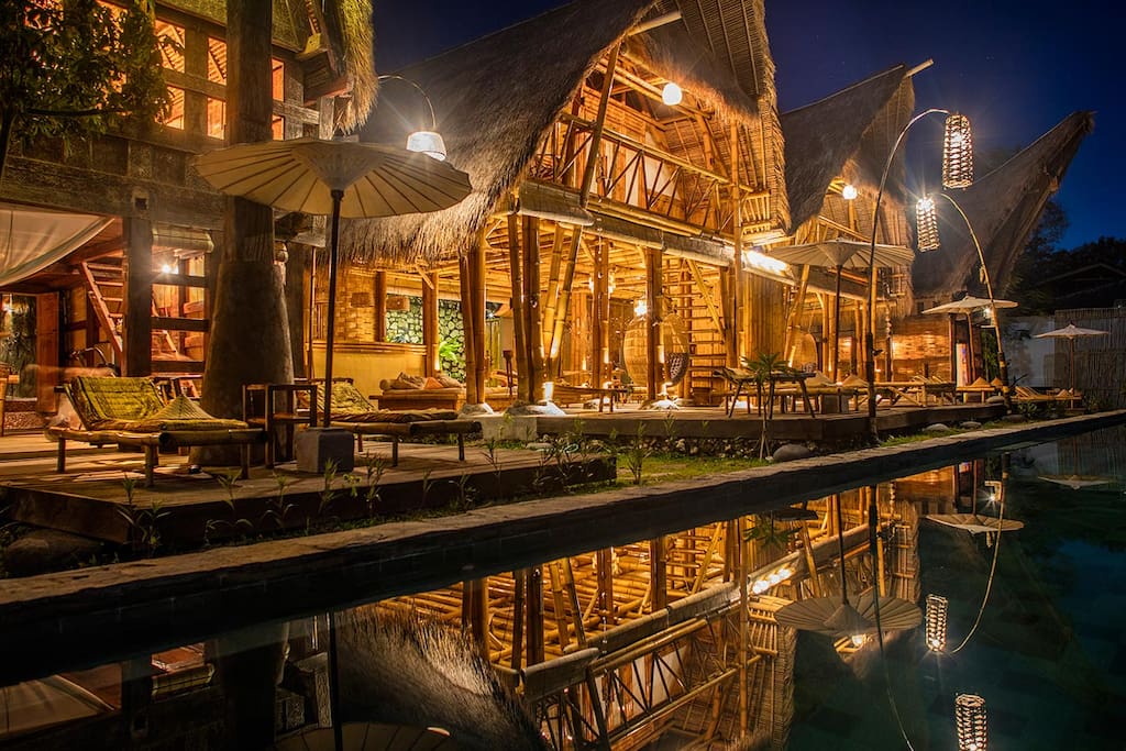 ligth design at bambu house and its reflection on the water