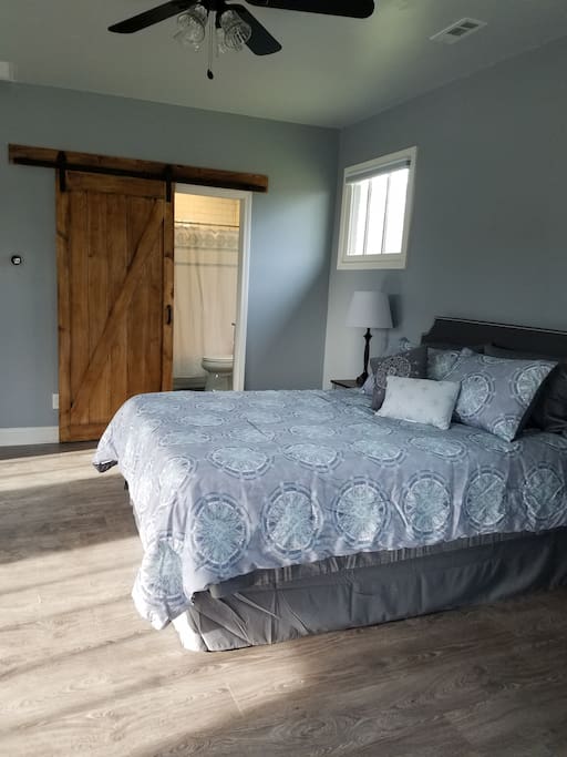 Queen bed and bathroom
