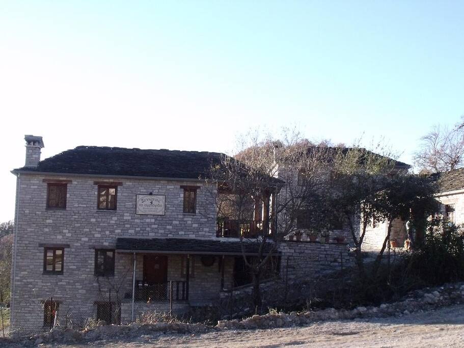 The east facade of the house as it is seen from the public car lot.
