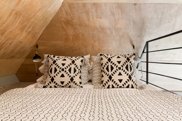 Queen size mattress in the carpeted loft. 