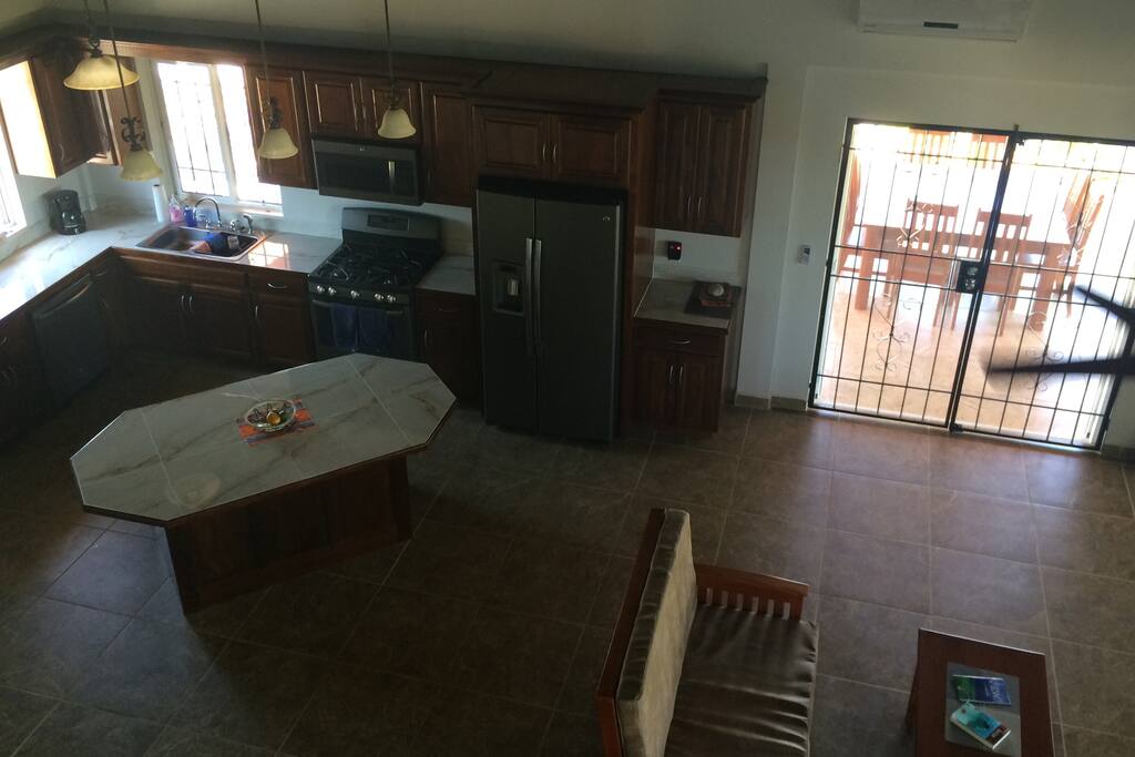 Kitchen living room area from loft. Doors go onto large patio
