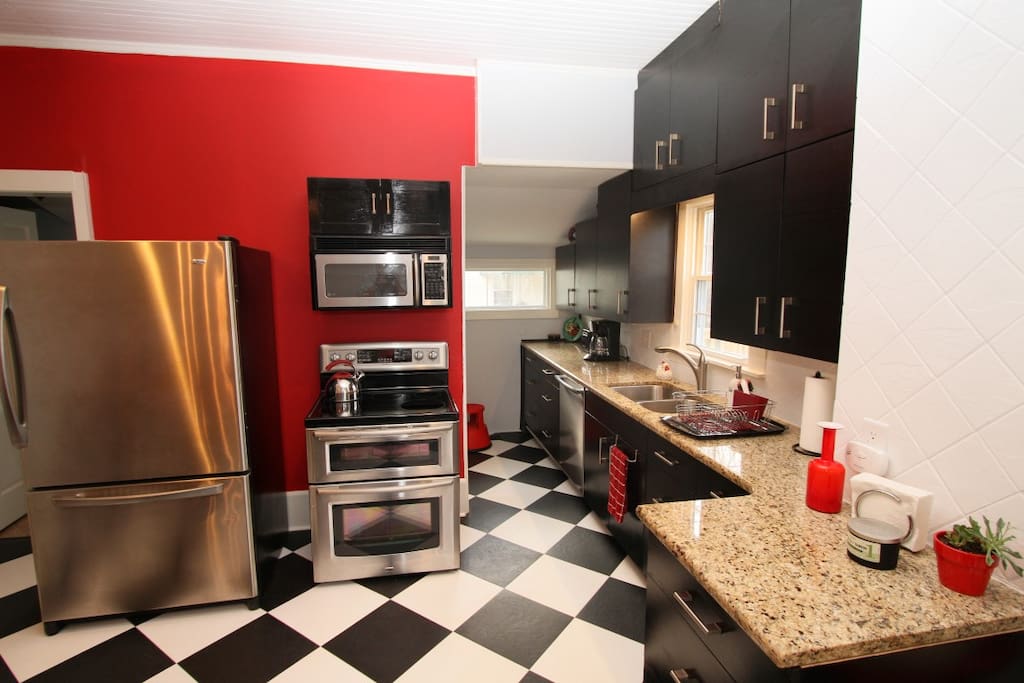Kitchen is fully equipped, including a dishwasher and washer and dryer.