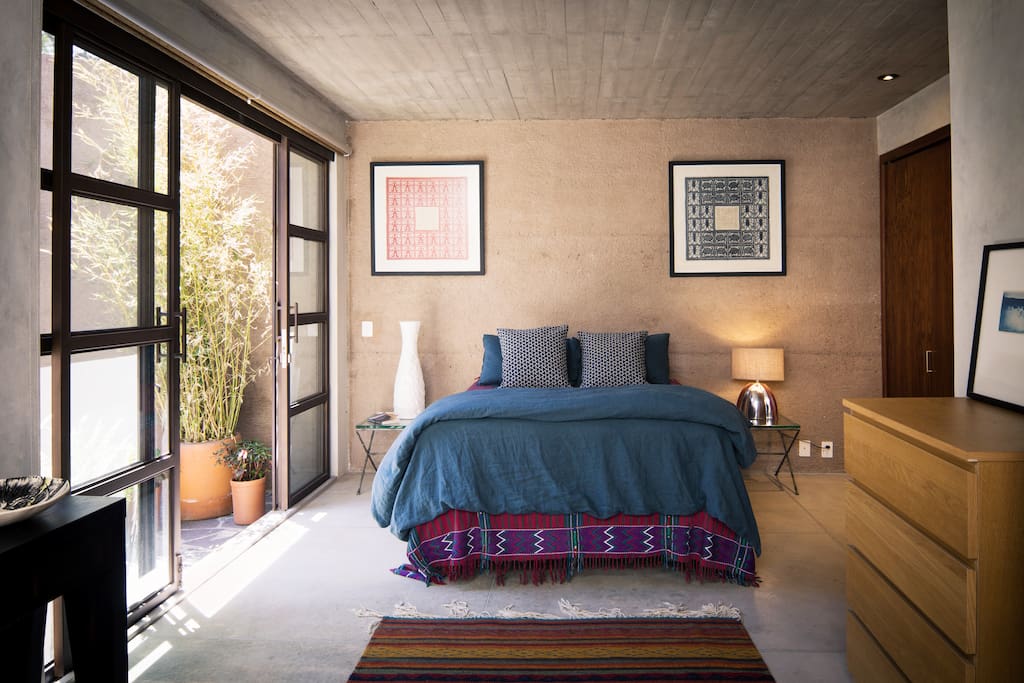 Master bedroom opens to a small private patio and outdoor shower.
