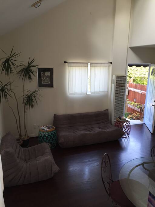 Lounge space with comfy ergonomic Togo sofa, chair, modern coffee tables, ipad for your use