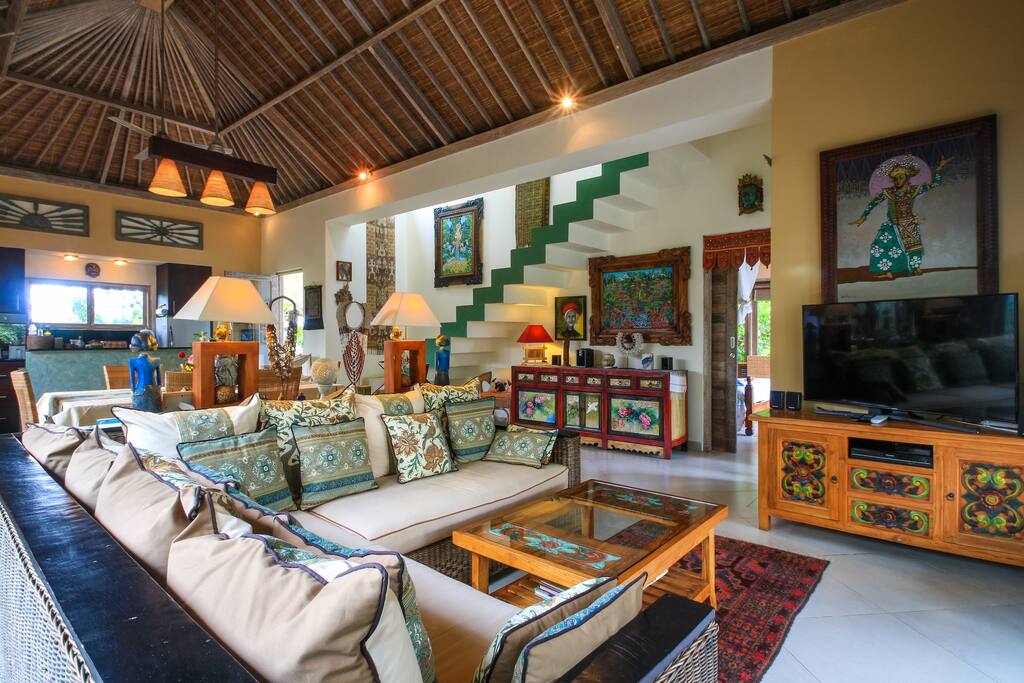 Open Plan Living, Dining and Kitchen Area Furnished with Antiques and Collectibles