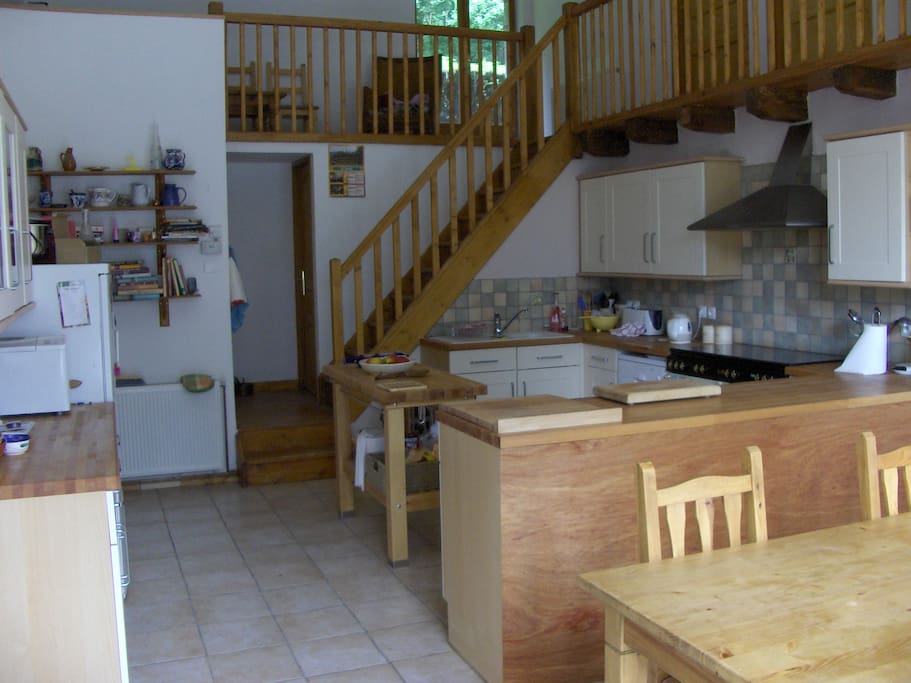 Very large kitchen with dining table.
