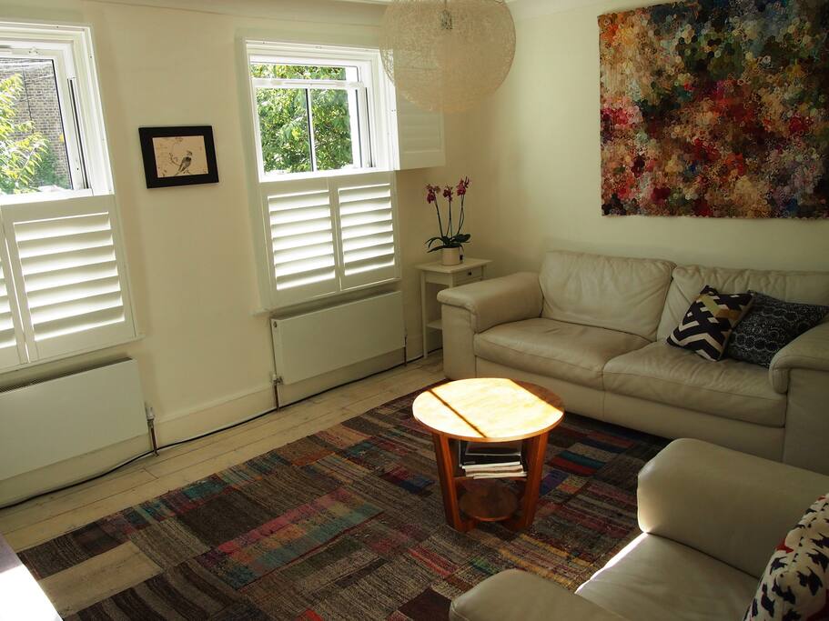 The first floor drawing room. It is bright and airy with views onto two cherry trees.