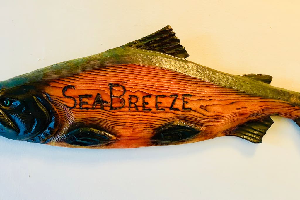 Holding the name to this vacation rental is a masterfully carved salmon made by a local artist.