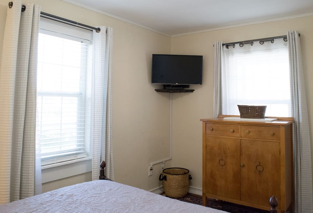 Dresser for your personal items and cable tv with all movie channels.