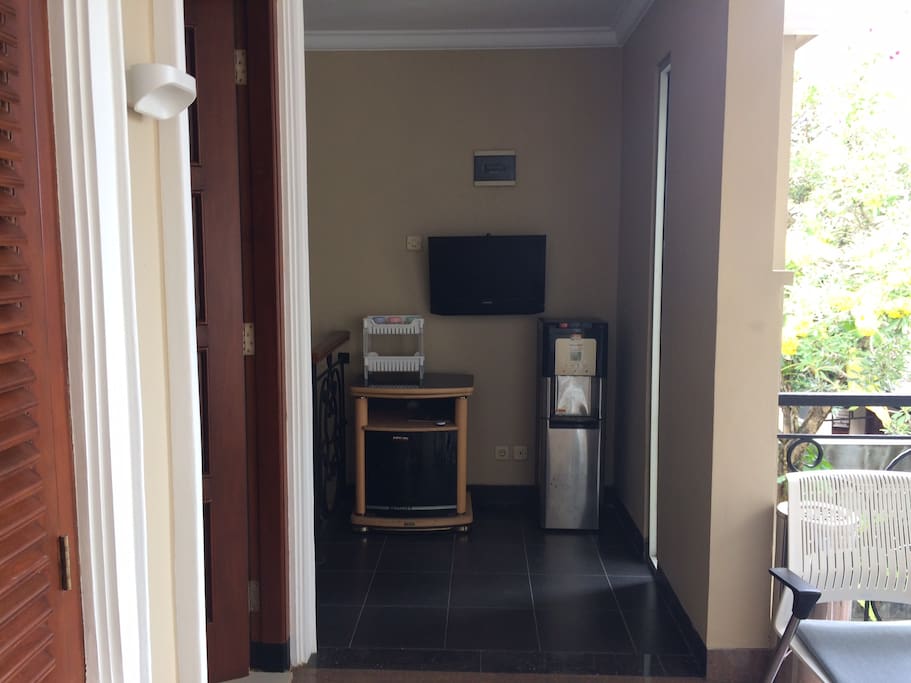 Tv and dispenser are outside the rooms