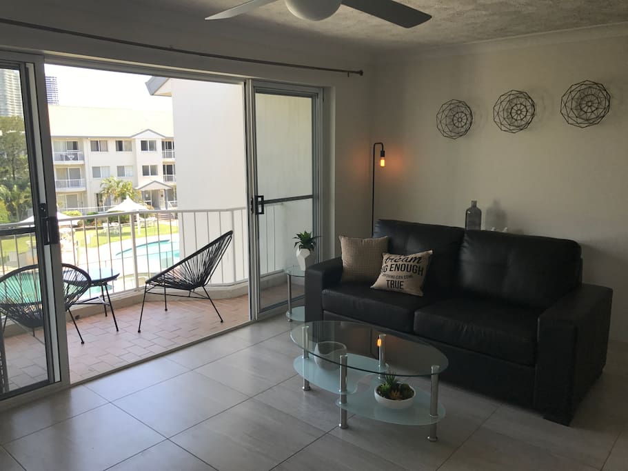 Lounge area and balcony. Full innerspring pullout leather sofa bed.