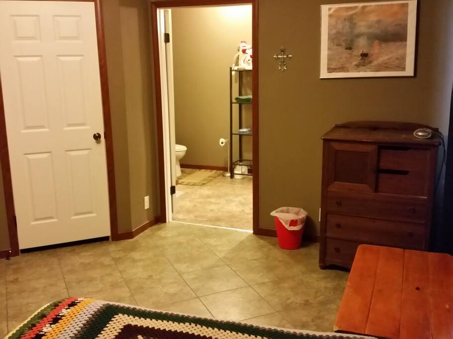 Walk-in closet and bathroom in the suite.