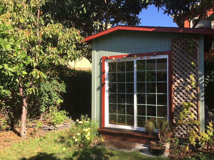 Garden cottage surrounded by fruit trees