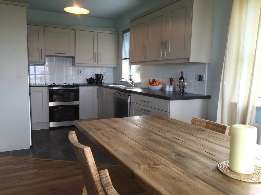 Completely new kitchen and extra long farm dining table.