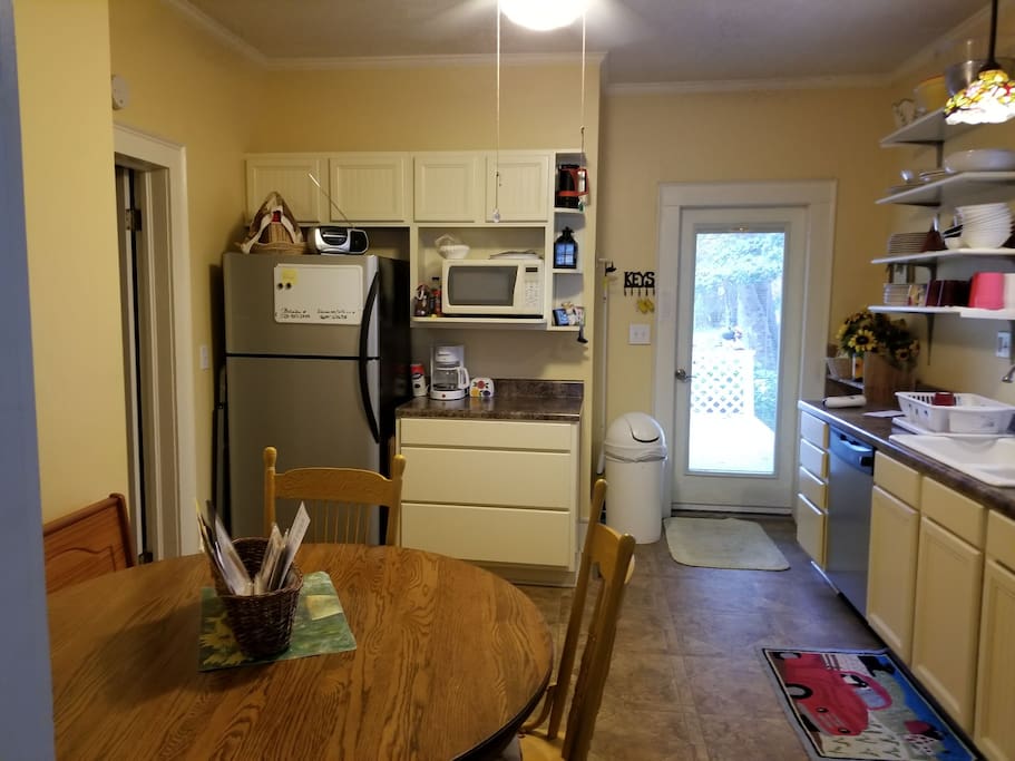 Eat-in kitchen. Double sink, full sized electric range not seen on the right.