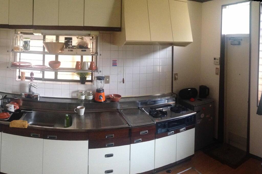 Large kitchen equipped with oven, mixer and Nespresso coffee machine