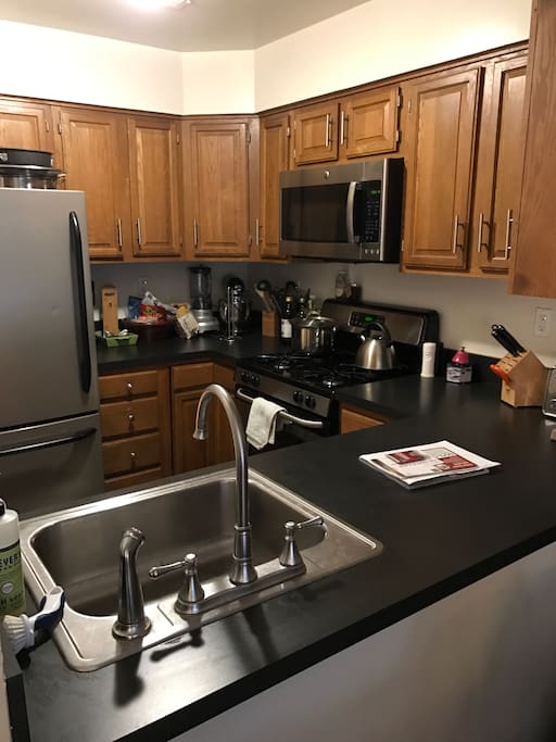 Kitchen with full size refrigerator, oven, and dishwasher