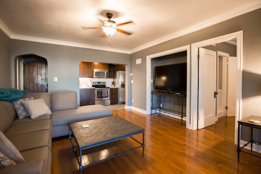 Living room with view of kitchen and bedroom